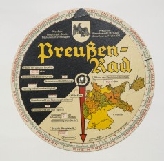Preußen-Rad, Drehscheibe schwarz-beige mit rotem Zeiger, Kartenausschnitt und Text